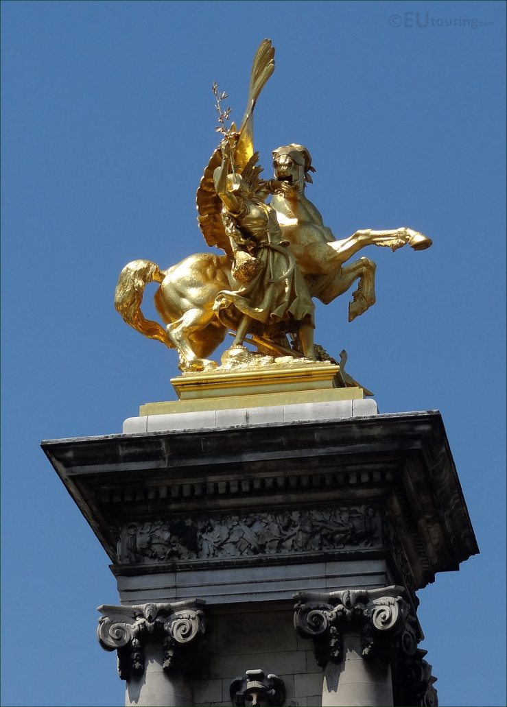 Golden statue on top of the column